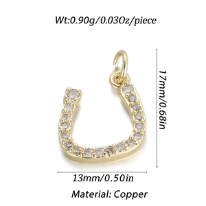Detailed view of U-shaped copper pendant with clear crystals and 14K gold plating