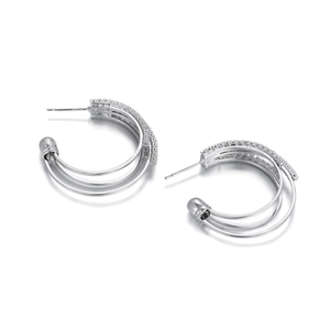 Detailed view of triple-layered silver hoop earrings with micro-pave cubic zirconia accents