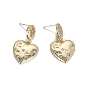 Detail of gold heart drop earrings with hammered texture and tiny star zircon inlays