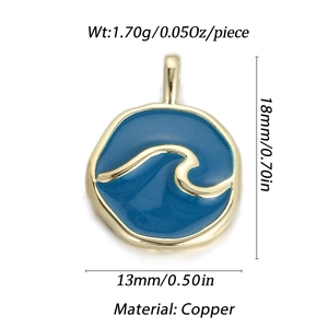 Macro detail of wave-patterned copper pendant with deep blue enamel inlay and gold plating