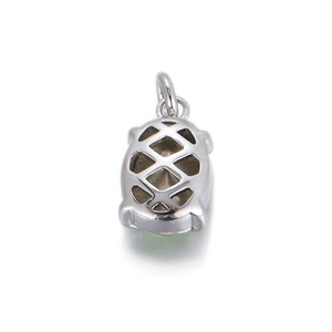 Detailed back view of a silver geometric pendant with hollow mesh and green gemstone