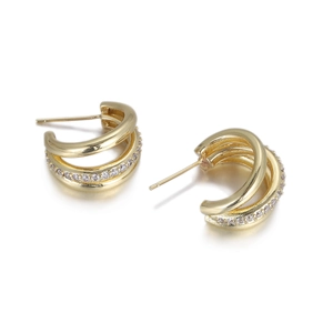 Close-up of golden triple-layer hoop earrings with micro-pave white zircon stones