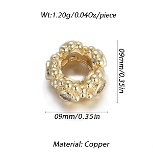 Macro shot of 9mm gold-plated copper bead charm with crystals and spherical texture