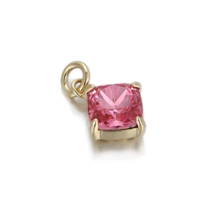 Macro view of cushion cut pink gemstone pendant with gold plated four-claw setting