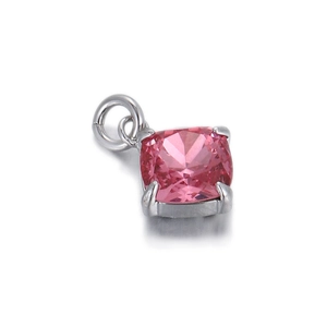 Macro detail of cushion cut pink gemstone pendant with silver four-prong setting