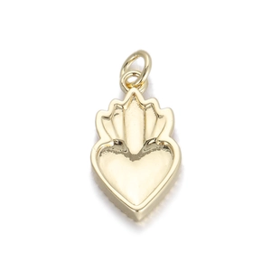 Detailed close-up of a golden heart pendant with a crown-like top on a white background