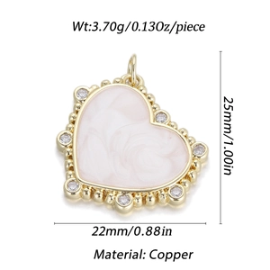 Detail showing 25mm 14K gold plated pink marble heart pendant with tiny cubic zirconia