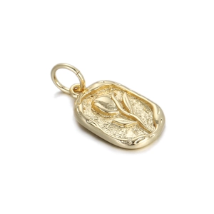 Detail of a golden rectangular pendant featuring an embossed tulip floral design