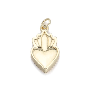 Detailed view of a golden heart pendant with sunburst patterns and high polish finish