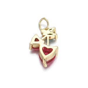 Detail of 14K gold plated cherry pendant featuring heart shaped red crystal accents