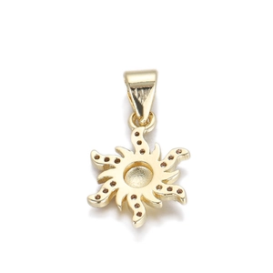 Detail view of a 14K gold-plated sun-shaped metal pendant with wavy rays and tiny dots