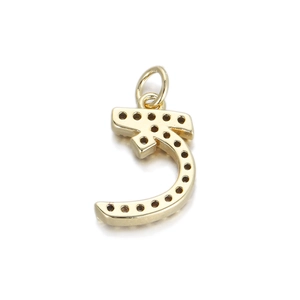 Detailed macro view of an Arabic letter pendant with black gemstones in 14K gold plating