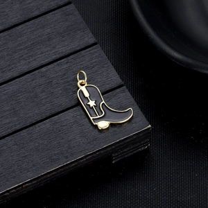Detail of western boot charm with black enamel and star design for DIY jewelry