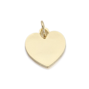 Close-up of polished gold heart-shaped pendant with mirror finish for jewelry DIY