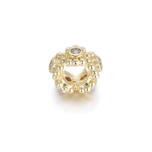 Detailed view of an 18K gold-plated beaded charm with lavender cubic zirconia crystals
