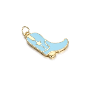 Detailed macro view of light blue enamel cowboy boot pendant with gold star accent