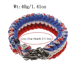 Detailed paracord survival bracelet with red white blue weave and metal dragon head clasp