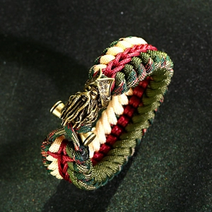 Close-up of tricolor paracord braid and brass octopus-style mythological metal clasp