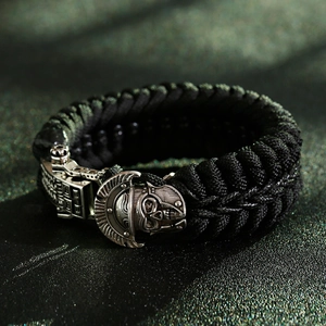Macro detail of survival paracord bracelet with vintage silver skull armor buckle