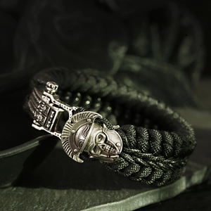 Close-up of parcord survival bracelet featuring a silver Spartan helmet skull clasp
