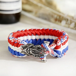 Close-up of tricolor paracord bracelet with vintage silver nautical pirate buckle