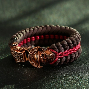 Macro shot of paracord survival bracelet with detailed skull armor metal buckle closure