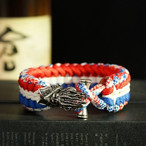 Detailed view of the red, white and blue tactical paracord bracelet with metal dragon clasp