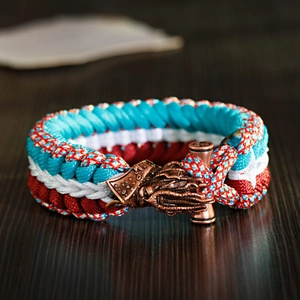 Macro detail of nautical paracord bracelet with bronze octopus kraken charm