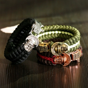 Survival paracord bracelets with spartan helmet beads in black, olive, and brown colors