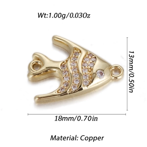 Macro view of gold-plated copper fish pendant with sparkling zircon inlays for jewelry