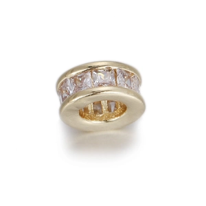 Detail of a gold-plated spacer bead with micro-pave square zircon stones for jewelry making
