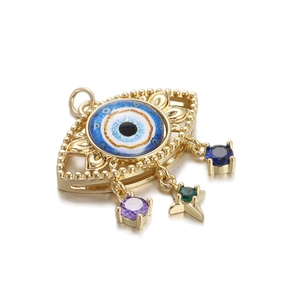 Detailed view of 14K gold plated Evil Eye pendant with colorful zircon star charms
