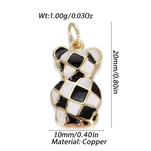 Detail of copper bear pendant with black and white checkered enamel and dimensions