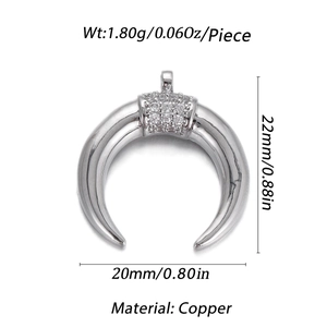 Macro detail of horn-shaped copper pendant with pavé cubic zirconia and dimensions