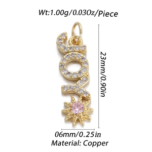 Macro shot of JOY gold-plated copper charm with pavé white zircon and pink star stone