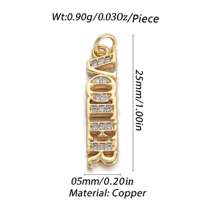 Macro detail of gold MOTHER pendant with cubic zirconia inlay including product dimensions