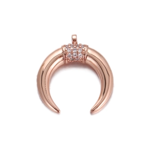 Macro shot of rose gold moon horn pendant with micro-set zircon stones in detail
