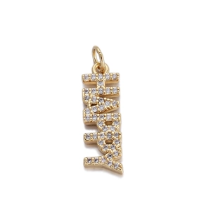 Detailed close-up of gold faith letter pendant with white cubic zirconia pavé setting