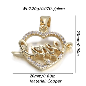 Macro view of 14k gold plated heart pendant with Love engraving and zircon stones