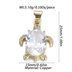 Macro detail of golden turtle pendant with zircon inlay and precise dimensions
