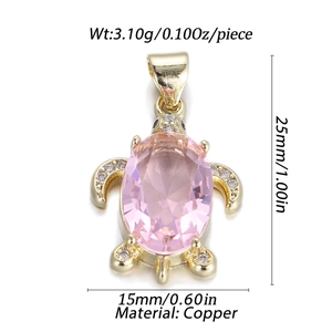Detailed close-up of a pink zircon sea turtle pendant with gold-plated copper and white crystals