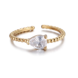 Anillo dorado de moda con circonita en forma de pera y banda de cuentas elegante