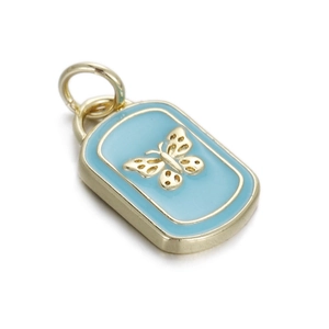 Macro detail of golden butterfly enamel pendant with rectangle blue finish and loop