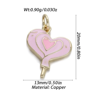 Macro shot of 14K gold plated copper heart lollipop pendant with pink enamel detail
