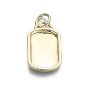 Detailed macro view of a polished golden rectangular pendant with double jump rings