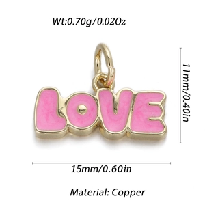 Macro view of a 14K gold-plated LOVE heart pendant with pink enamel for DIY jewelry