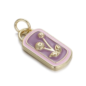 Detailed shot of rectangle cherry enamel charm with gold plating and purple finish