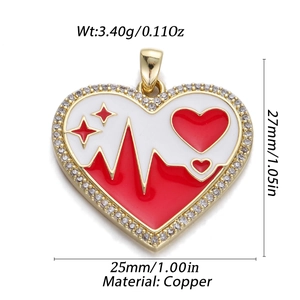 Detailed view of 14K gold plated heart pendant with red enamel and pavé rhinestones