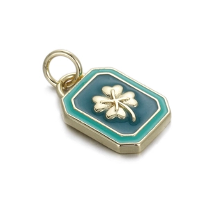 Detailed close-up of green enamel clover pendant with golden octagon metal frame