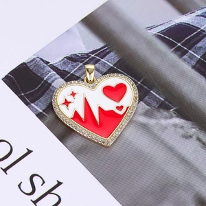 Close-up of heart-shaped 14K gold plated pendant with enamel detail and white zircons